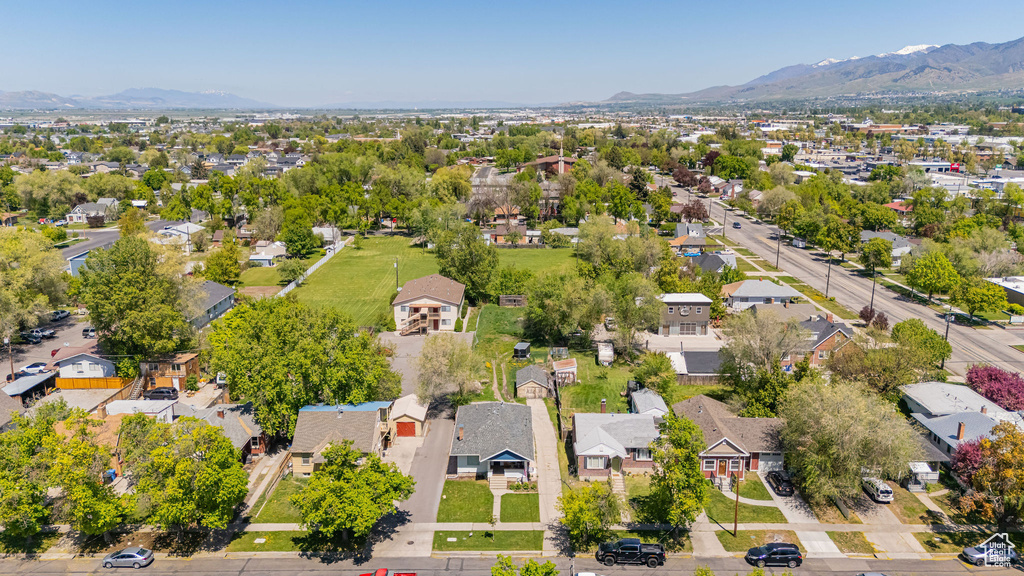 Aerial view of residential area featuring mountains