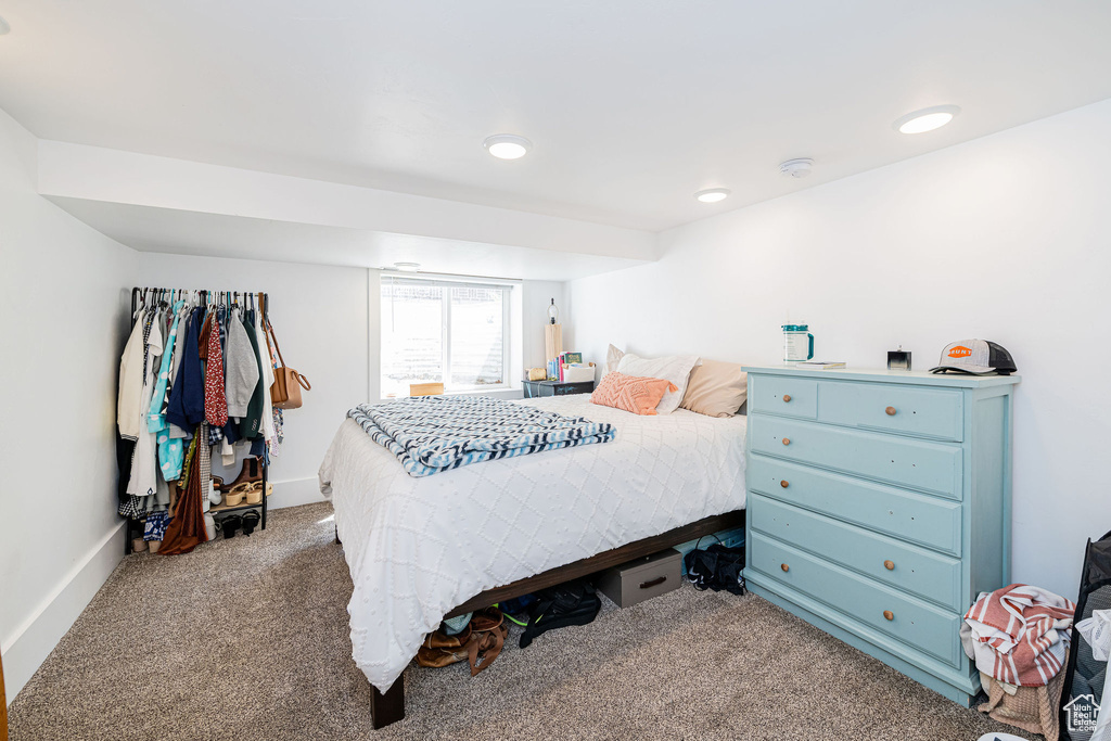 Bedroom with carpet, baseboards, and recessed lighting
