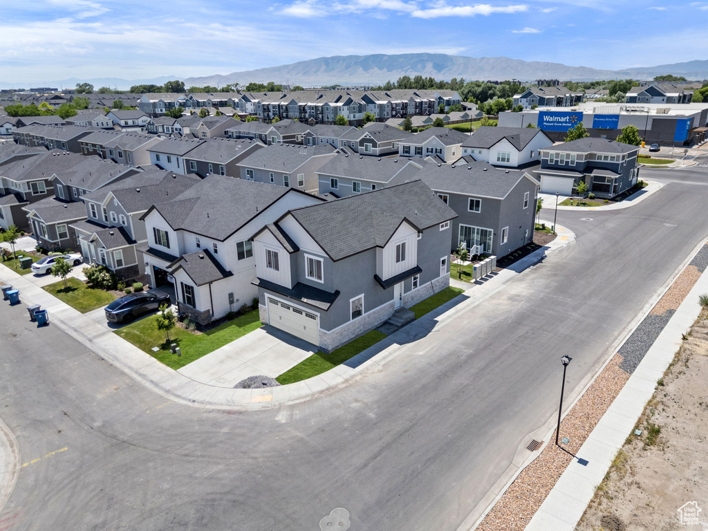 Aerial view of residential area featuring a mountainous background