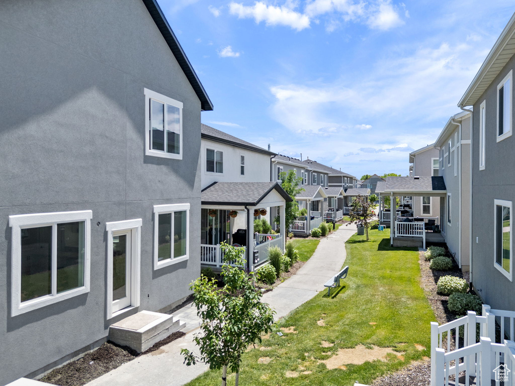 View of grassy yard featuring a residential view