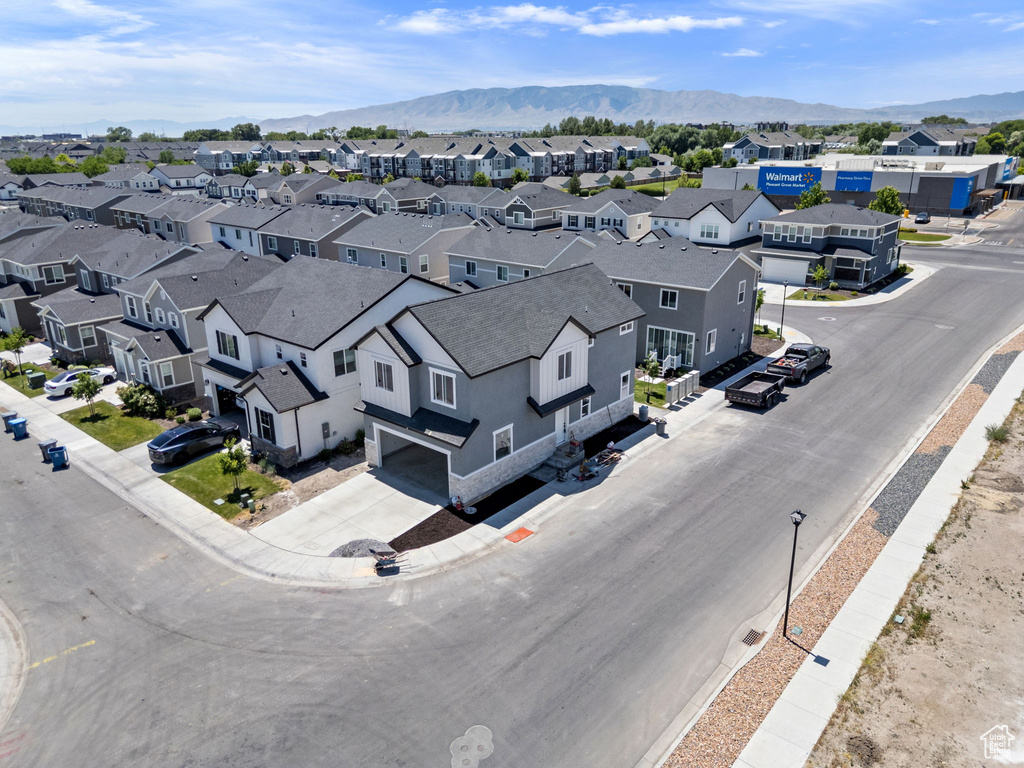 Aerial view of residential area featuring a mountainous background