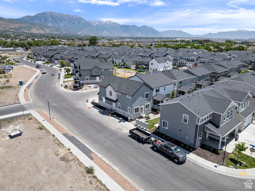 Aerial perspective of suburban area featuring a mountain backdrop