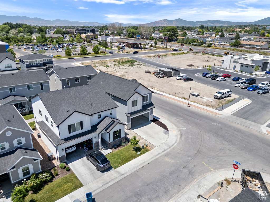 Aerial view of residential area featuring a mountainous background