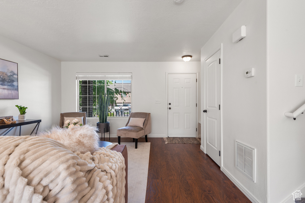 Living area featuring wood finished floors and baseboards