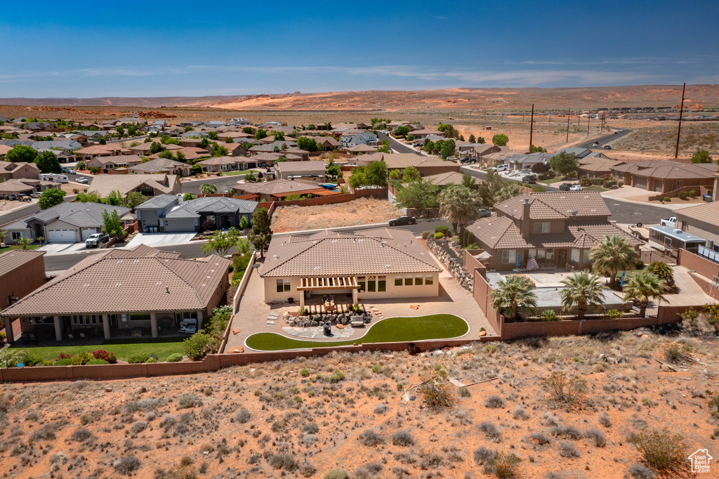 Aerial perspective of suburban area featuring a mountainous background