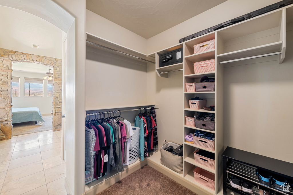 Walk in closet featuring tile patterned flooring