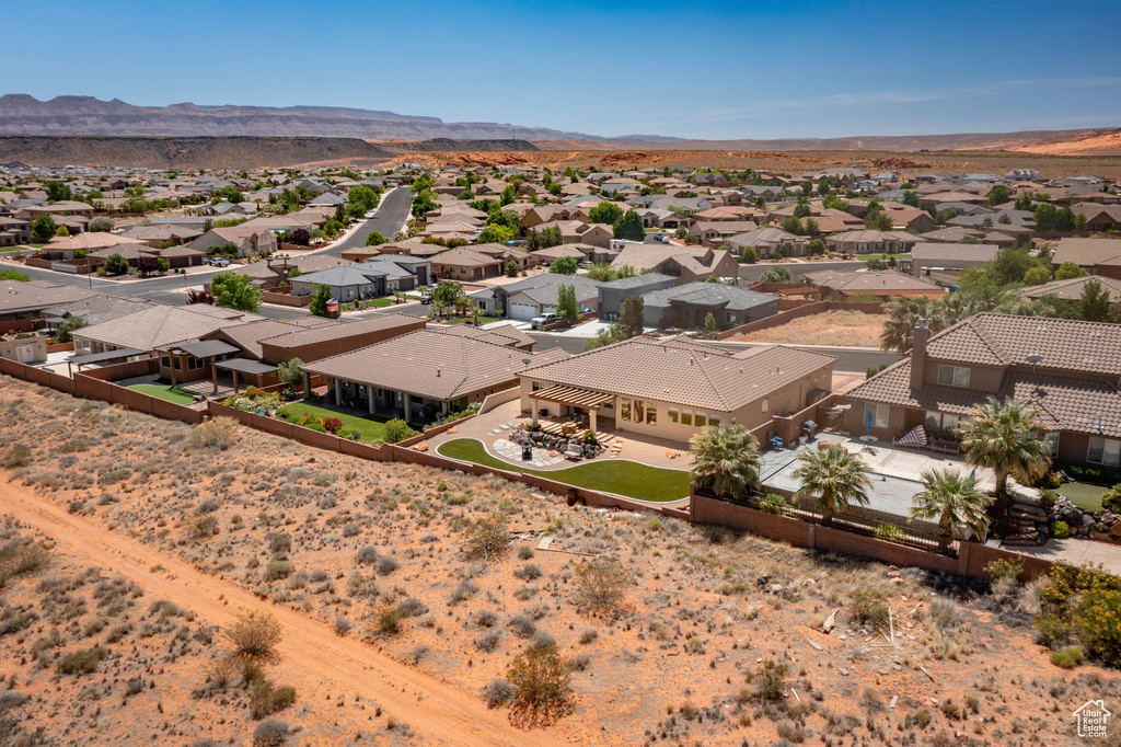 Aerial view of residential area featuring a mountainous background