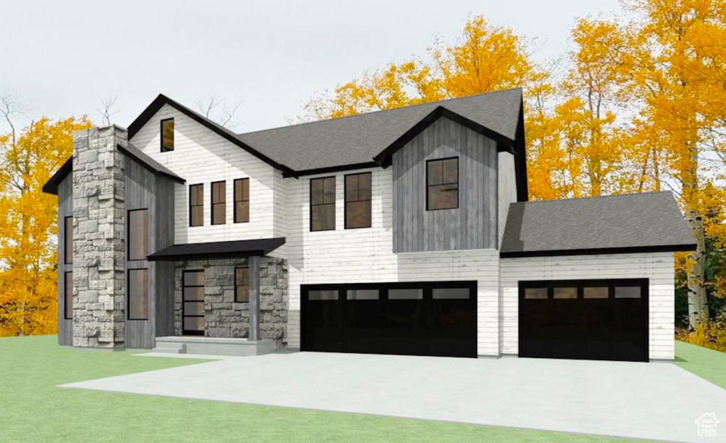 View of front of house featuring stone siding, concrete driveway, a front lawn, and a garage
