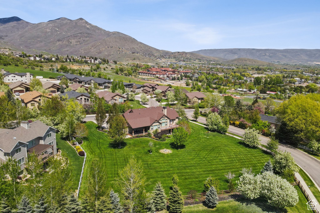 View of property location featuring a mountain backdrop and nearby suburban area