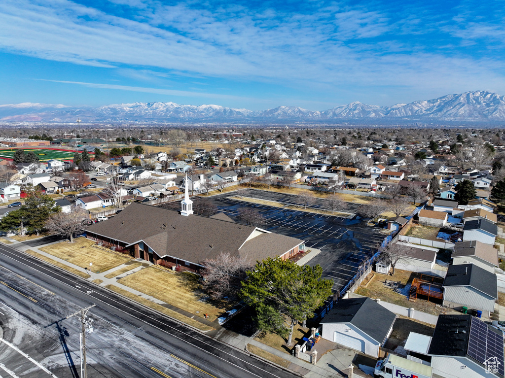 Aerial view of residential area featuring a mountain backdrop