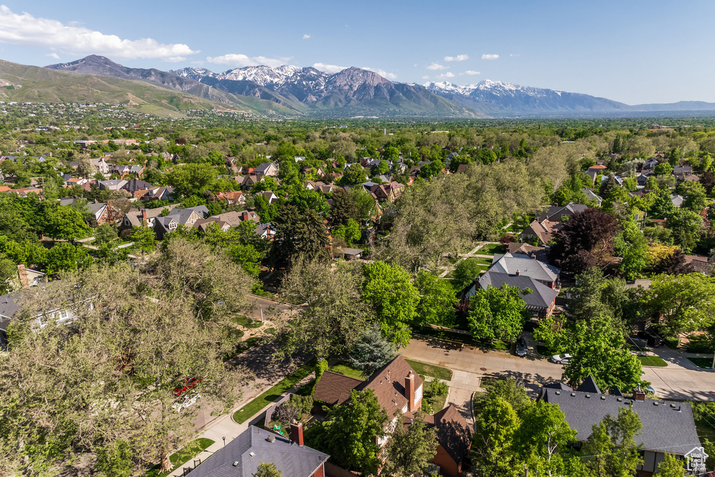Aerial view of residential area featuring a mountainous background