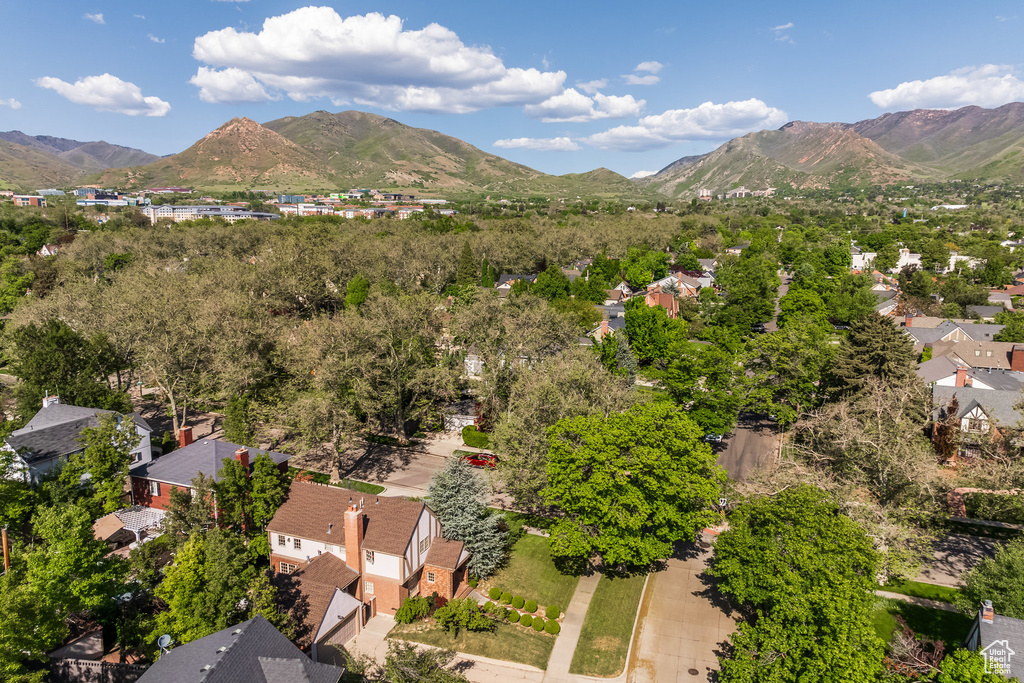 Aerial perspective of suburban area featuring a mountain backdrop