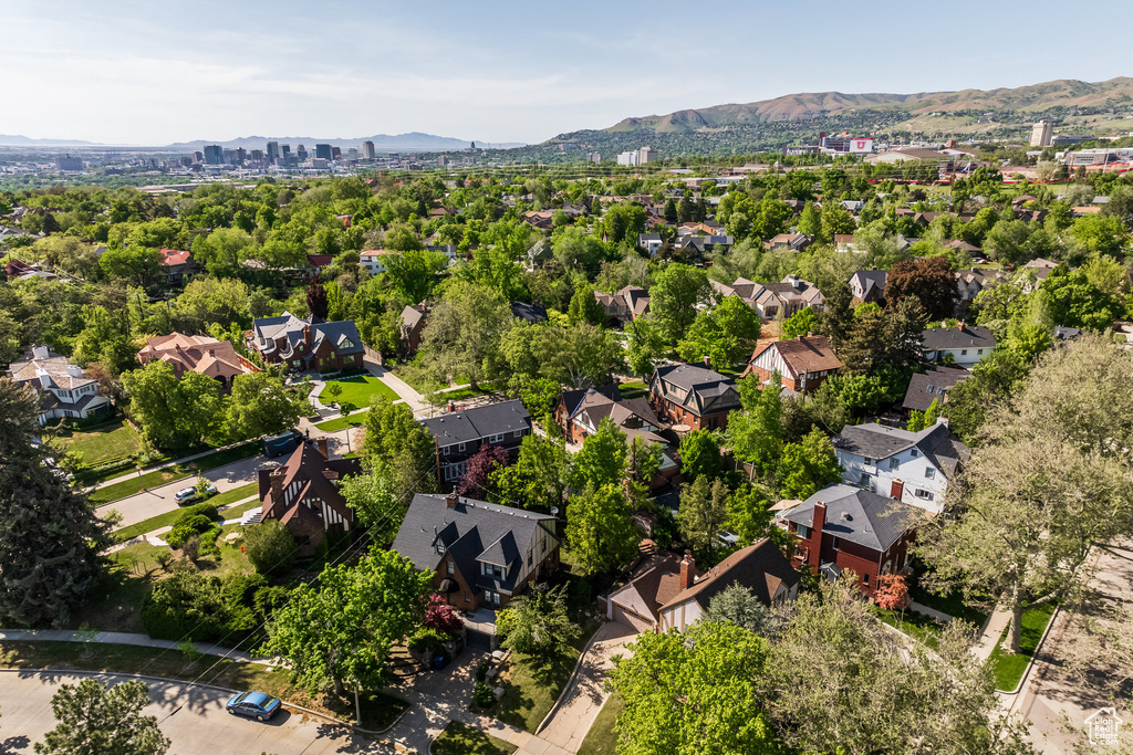 Aerial perspective of suburban area with a mountain backdrop