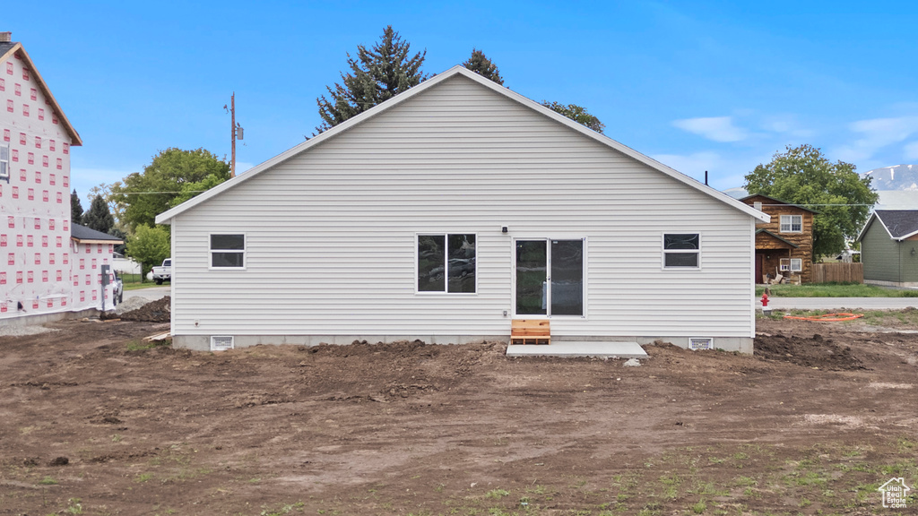 Rear view of property featuring entry steps