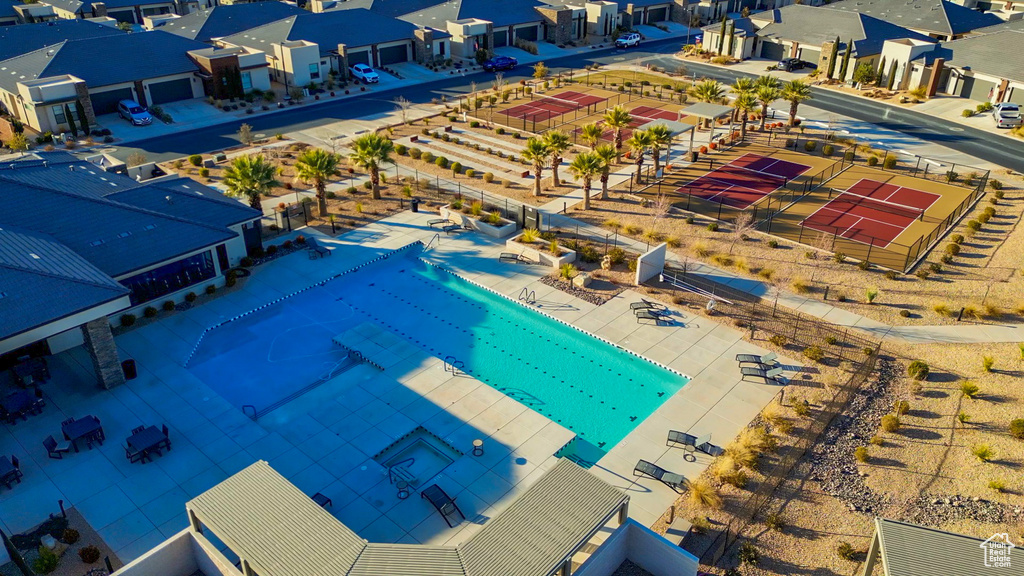 Aerial perspective of suburban area with a pool area