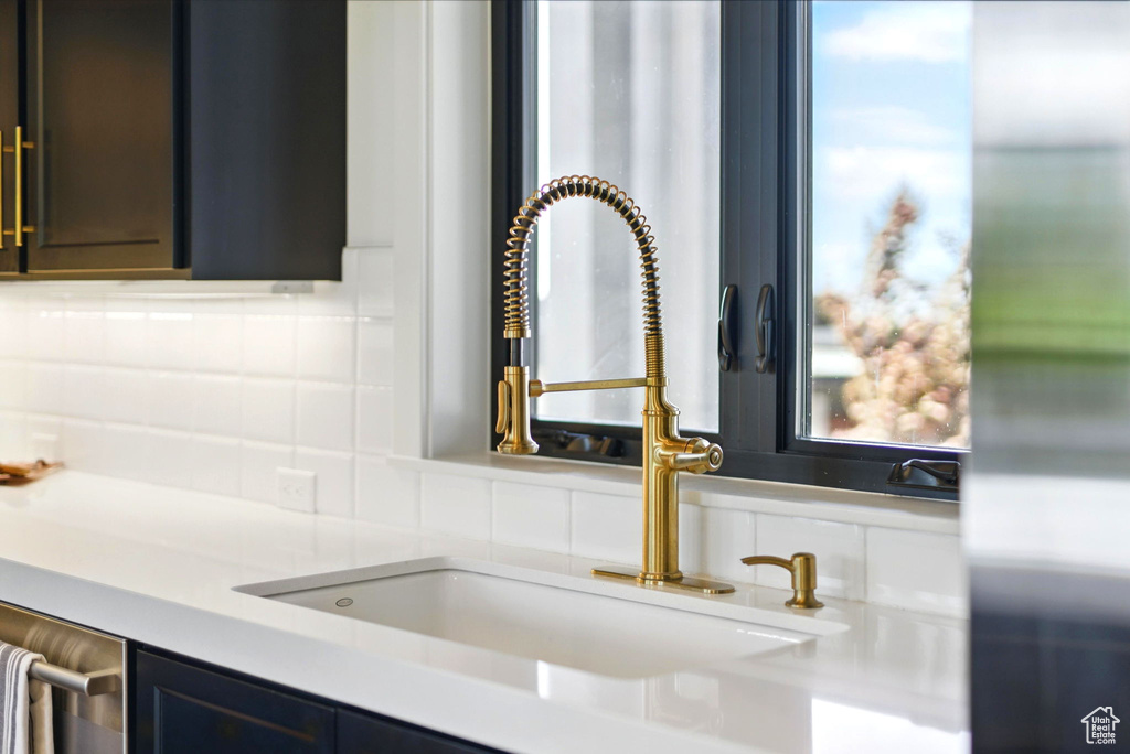 Detailed view of a sink and backsplash