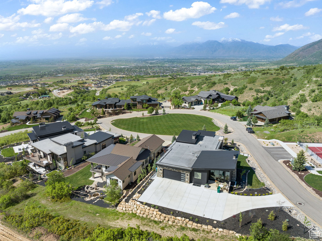 Aerial perspective of suburban area featuring a mountainous background