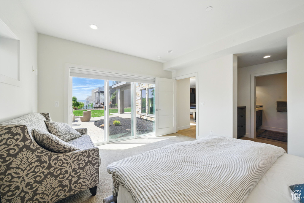Bedroom featuring access to outside, recessed lighting, and baseboards