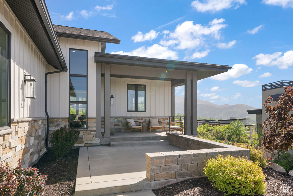 View of patio with covered porch and a mountain view