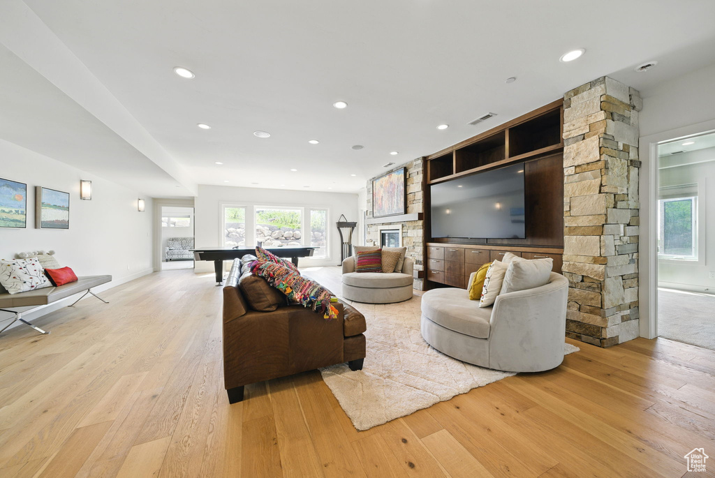 Living area with light wood-style floors, pool table, and recessed lighting