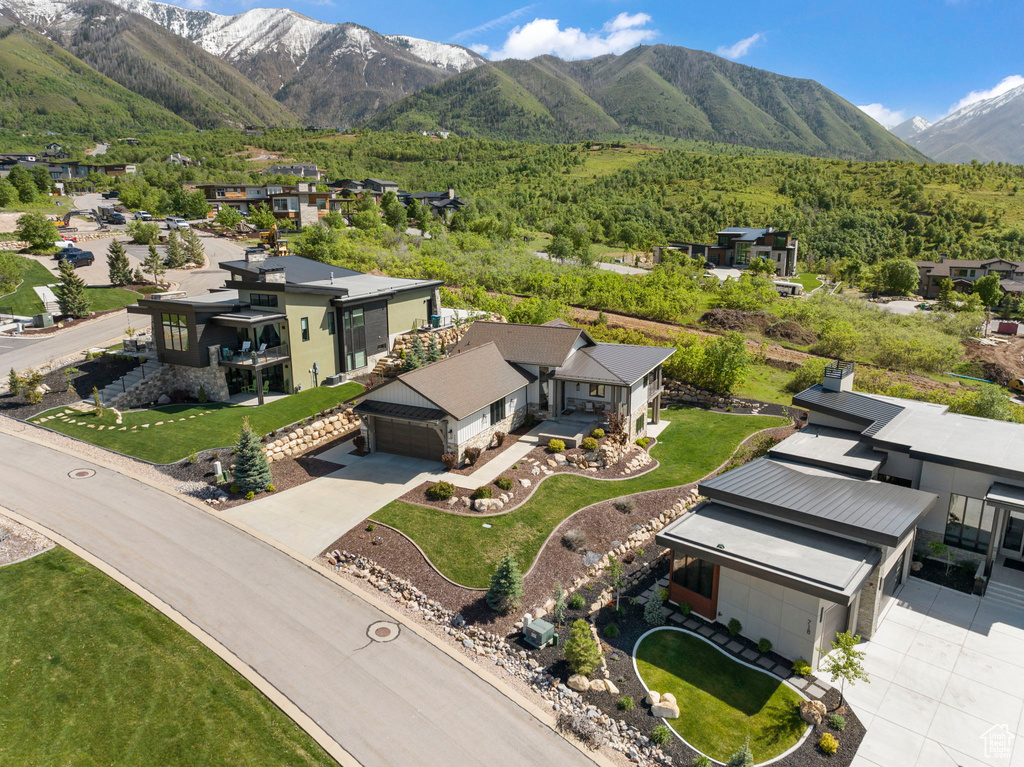 Aerial perspective of suburban area with a mountainous background