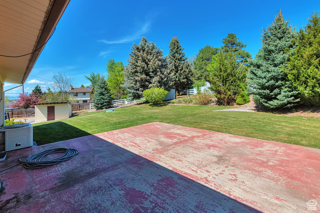 View of patio featuring a shed and an outdoor structure