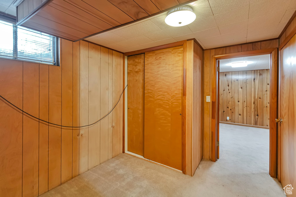 Corridor with wooden walls and carpet floors