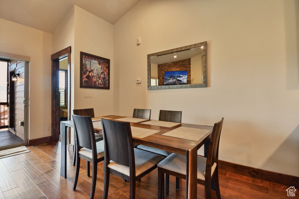 Dining room featuring wood finished floors and baseboards