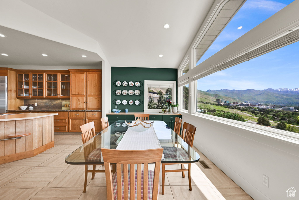 Dining area with a mountain view and recessed lighting