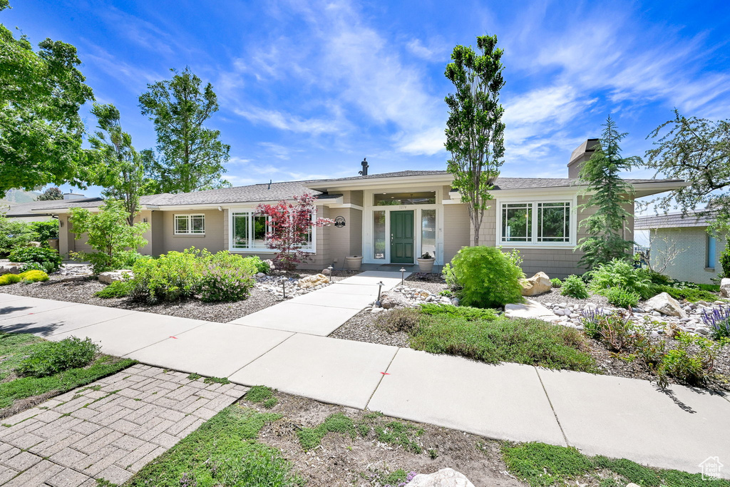 Ranch-style home with a chimney