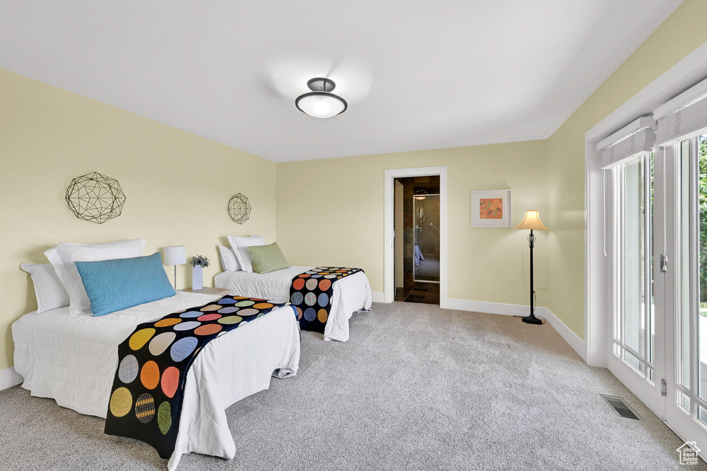 Carpeted bedroom featuring baseboards