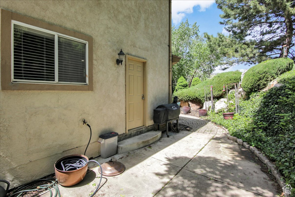 View of patio / terrace featuring a grill and entry steps