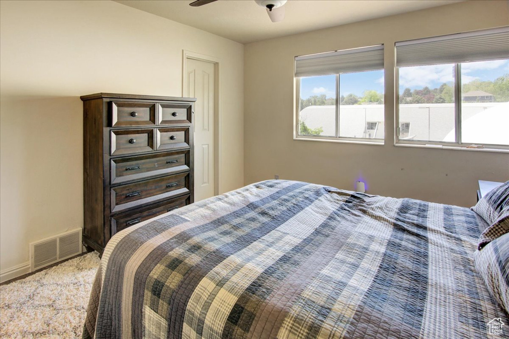 Bedroom featuring a ceiling fan and baseboards