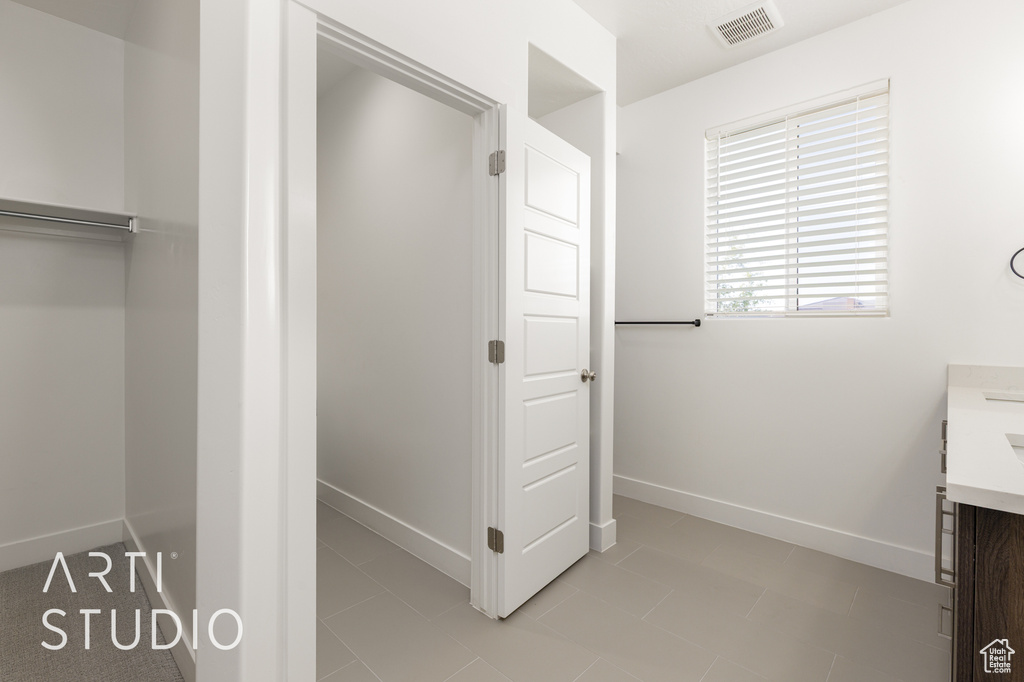 Bathroom with vanity and baseboards