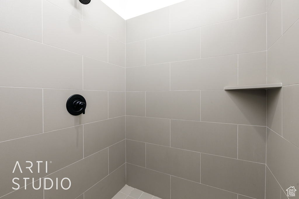 Full bathroom with tiled shower