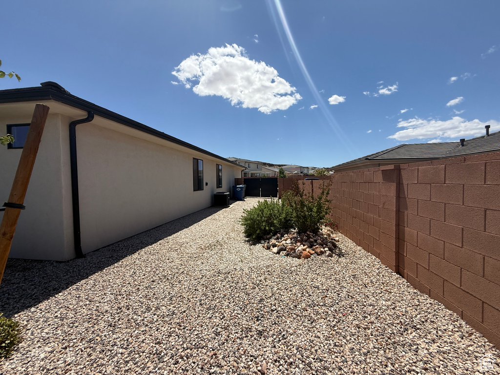 View of home's exterior with a fenced backyard and stucco siding