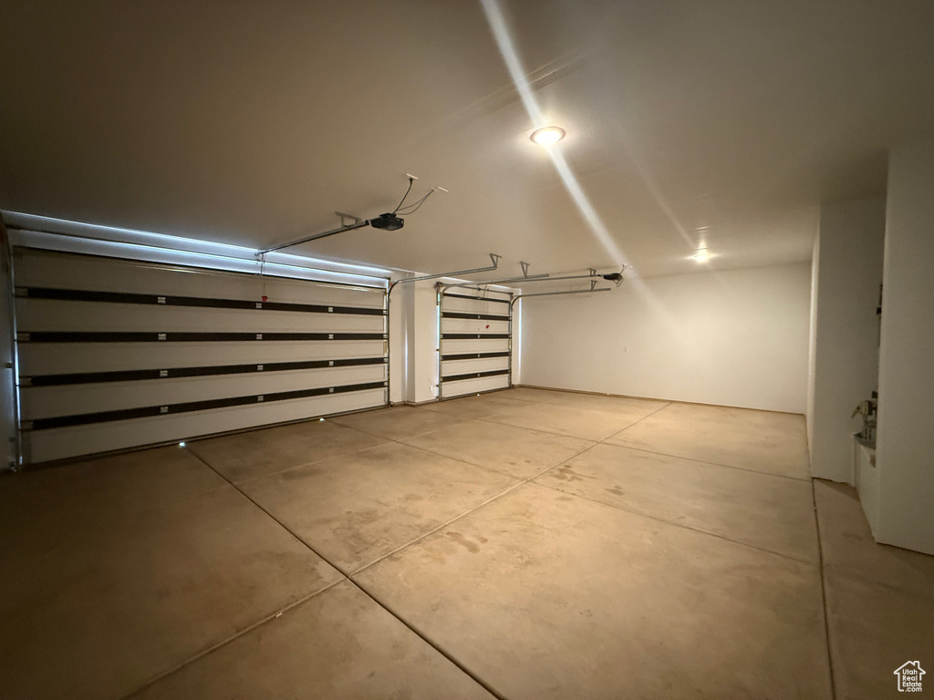 Garage featuring a garage door opener