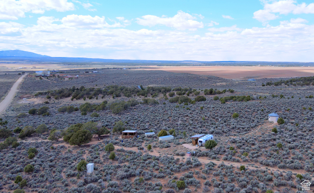 View of rural area featuring a mountainous background and a desert landscape