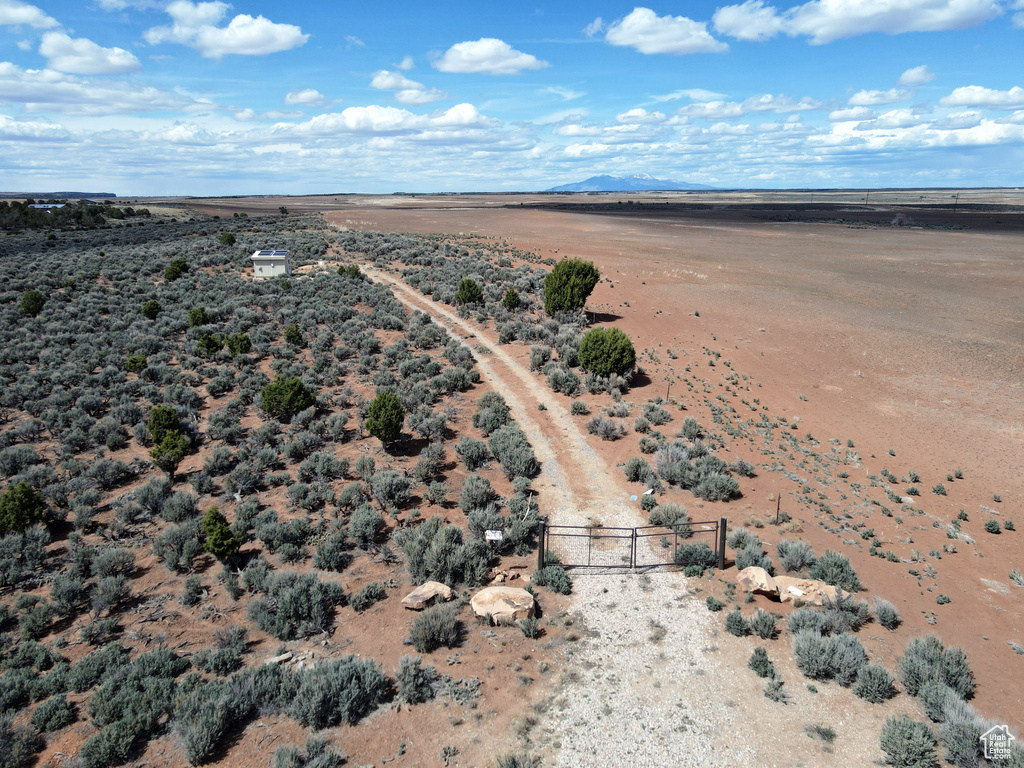 Overview of rural landscape featuring a mountain backdrop and a desert landscape