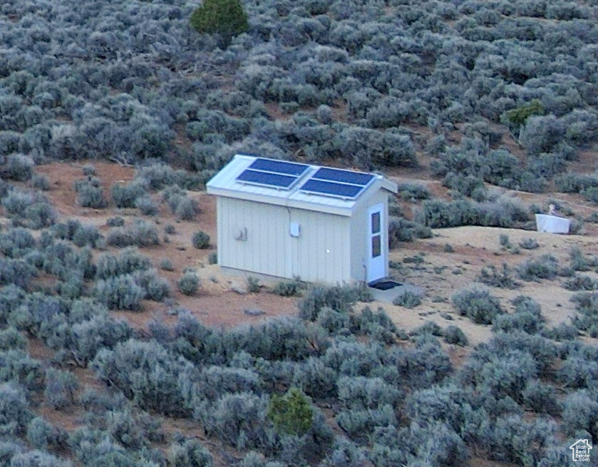 View of outdoor structure with an outbuilding