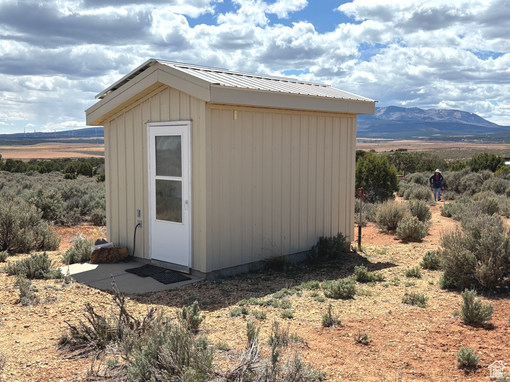 View of shed with a mountain view