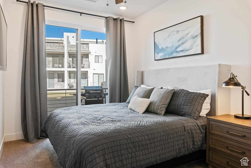 Carpeted bedroom with baseboards