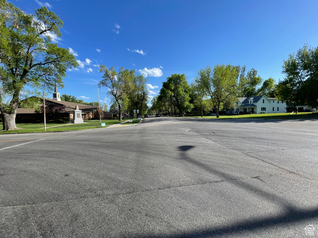 View of asphalt road with curbs