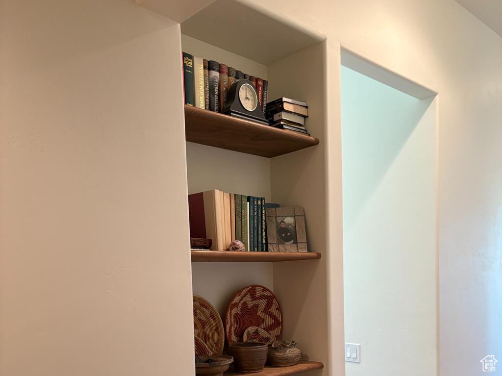 Hall with wood finished floors and baseboards