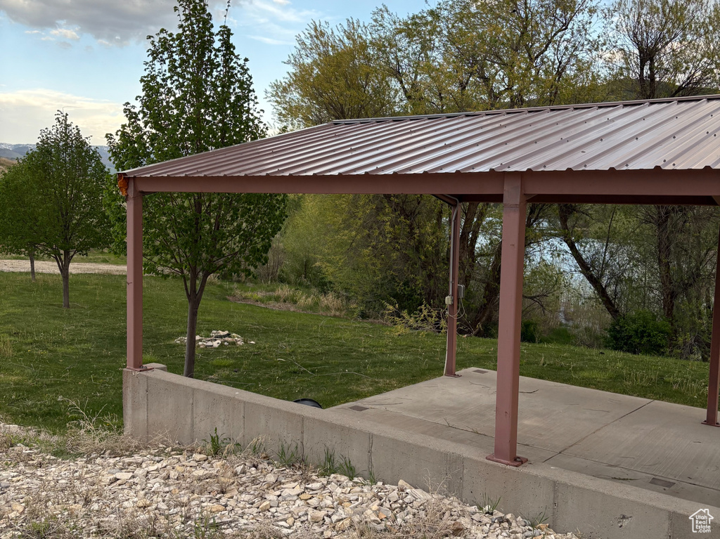 View of community featuring a gazebo, a lawn, and a patio