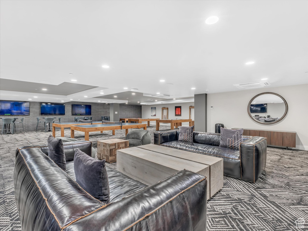 Living area featuring carpet flooring and recessed lighting