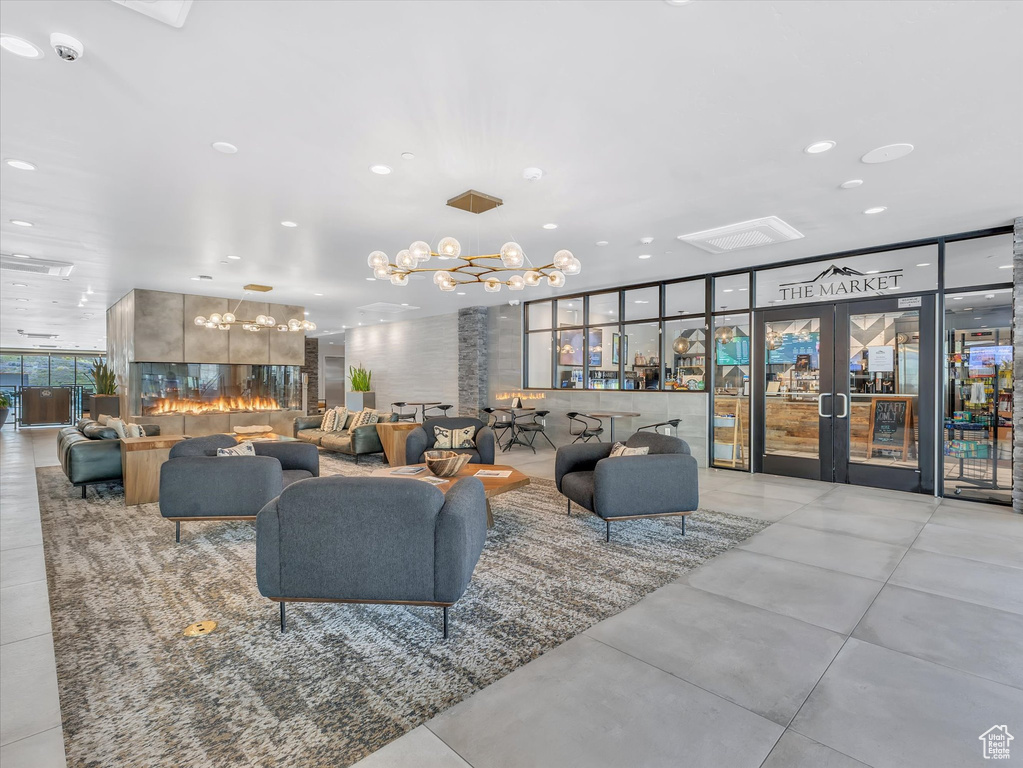 Community lobby featuring floor to ceiling windows and recessed lighting