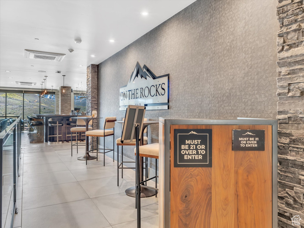 Reception area with floor to ceiling windows and recessed lighting