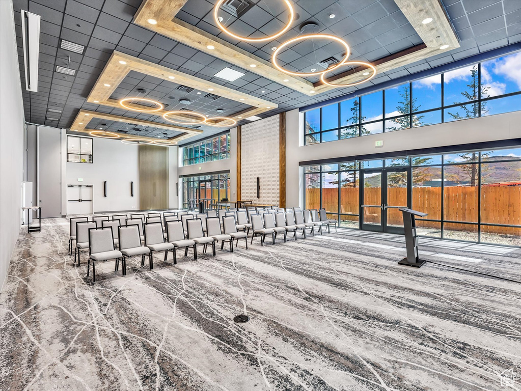 Lobby featuring a high ceiling and recessed lighting