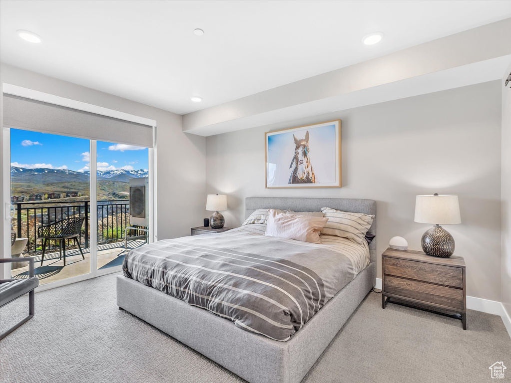 Bedroom with access to exterior, carpet floors, recessed lighting, and baseboards